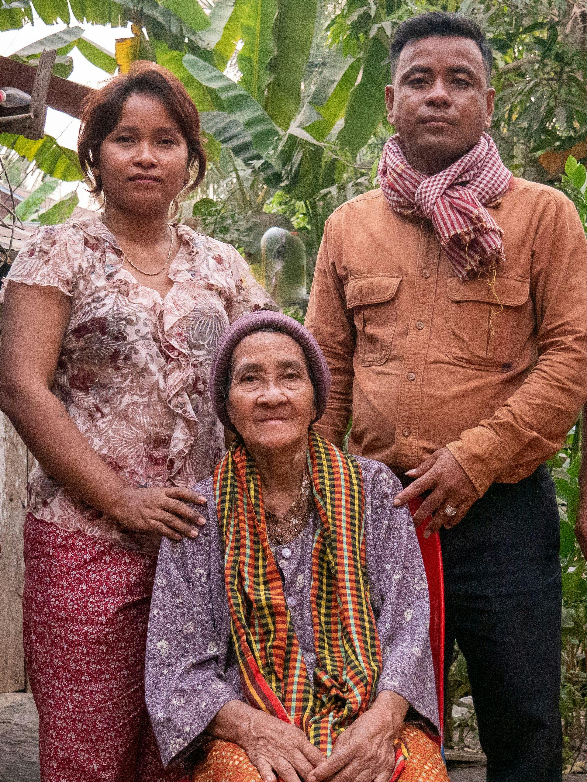Figure 5. Siblings KOEUY Leakhena and KOEUY Reatha with their mother LAV Mech (seated), wife of angkuoch-maker MONG Koeuy. Photo: Catherine Grant, 17 January 2020.